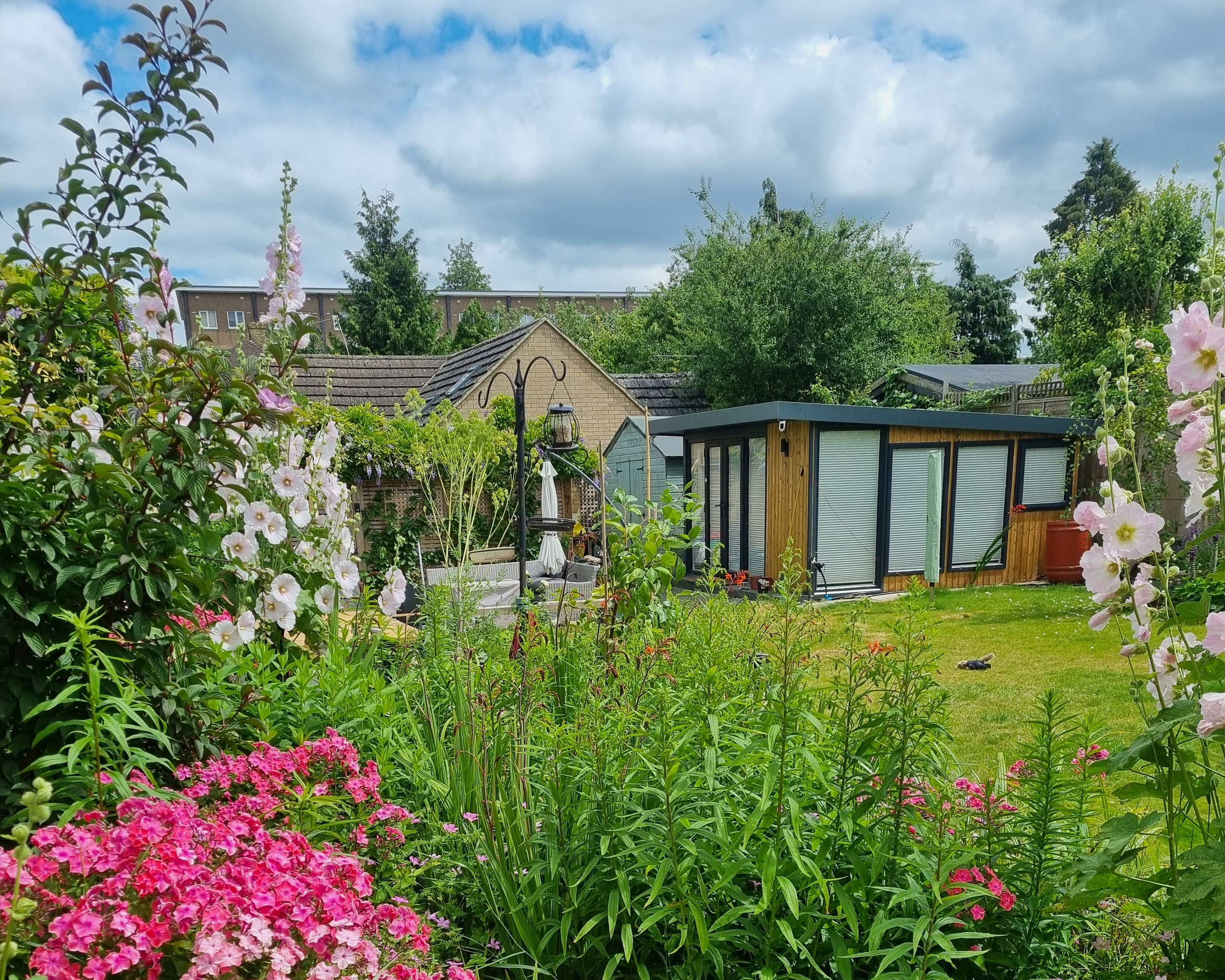 Installed garden room in a finished garden setting